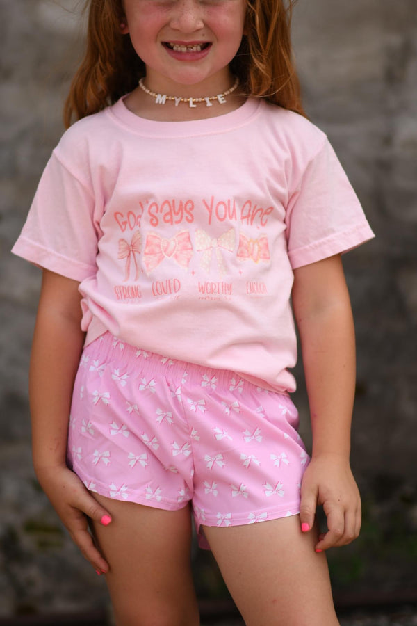 God says you are • adult or youth baby pink tee