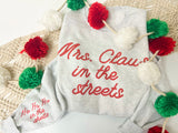 Mrs. Claus in the streets sweater